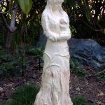 20-inch hand-built, stoneware sculpture of Gaia cradling a bunny, by Peggy Grigor